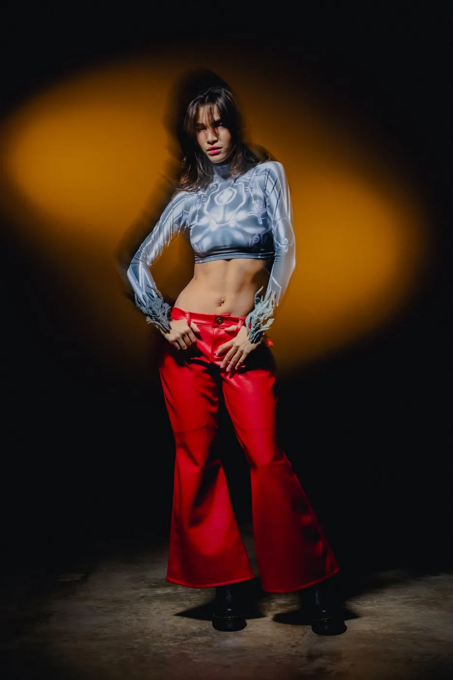 APEREIRA studio campaign: Chrome-print top and red flared pants