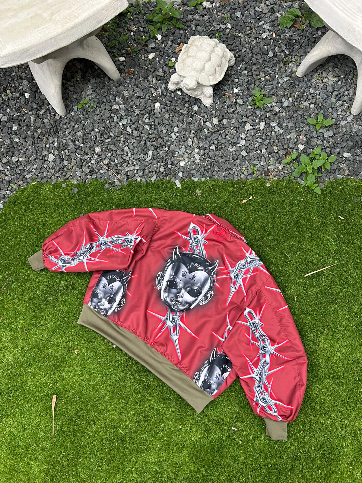 Red printed jacket on the grass